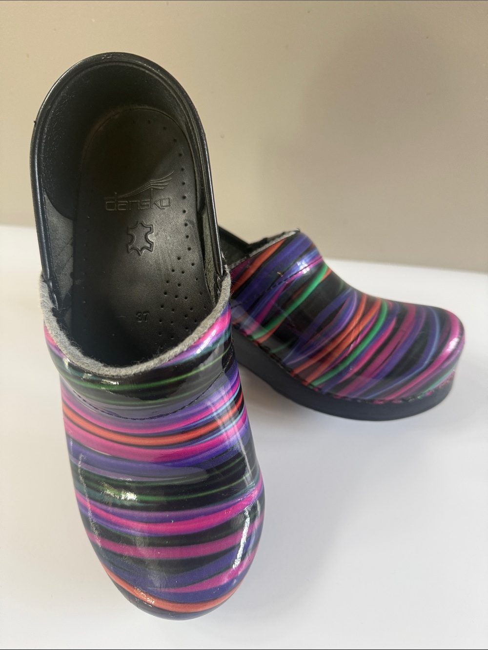 Dansko Multicolored Striped Leather Clogs in Purple, Pink, Green, Black